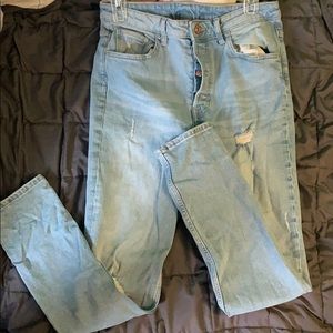 Distressed denim jeans.